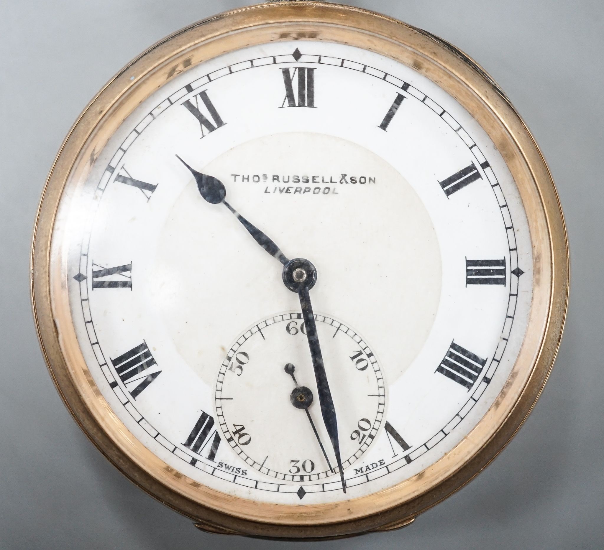 A George V 9ct gold open faced keyless pocket watch by Tomas Russell & Son, Liverpool, with Roman dial and subsidiary seconds, case diameter 49mm, gross weight 86.2 grams.